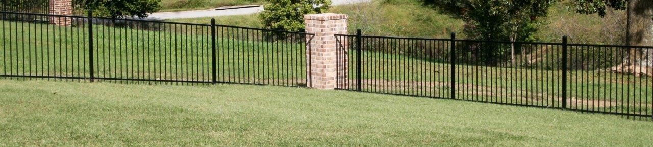 iron fence with brick columns