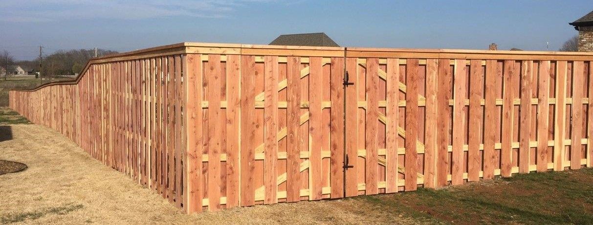 Board on board cedar fence with varying heights