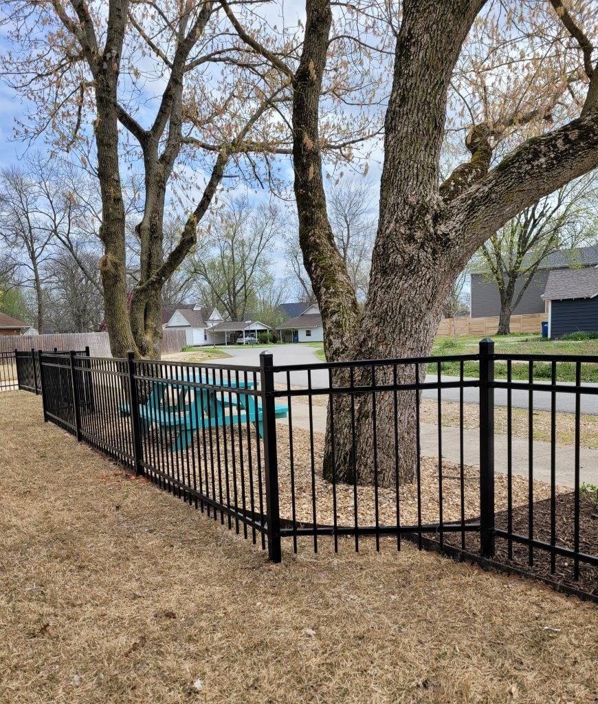 iron fence surrounding picnic table