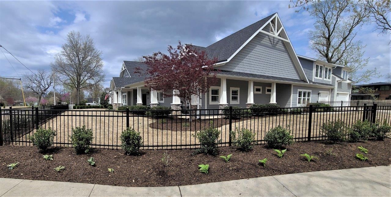 iron fence with landscaping