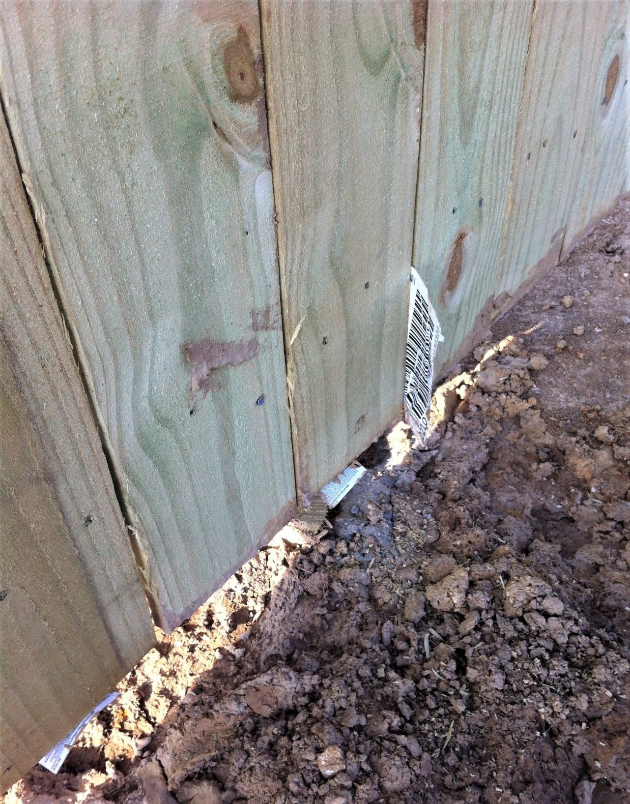 a wooden fence with a label on it that says ' fence '