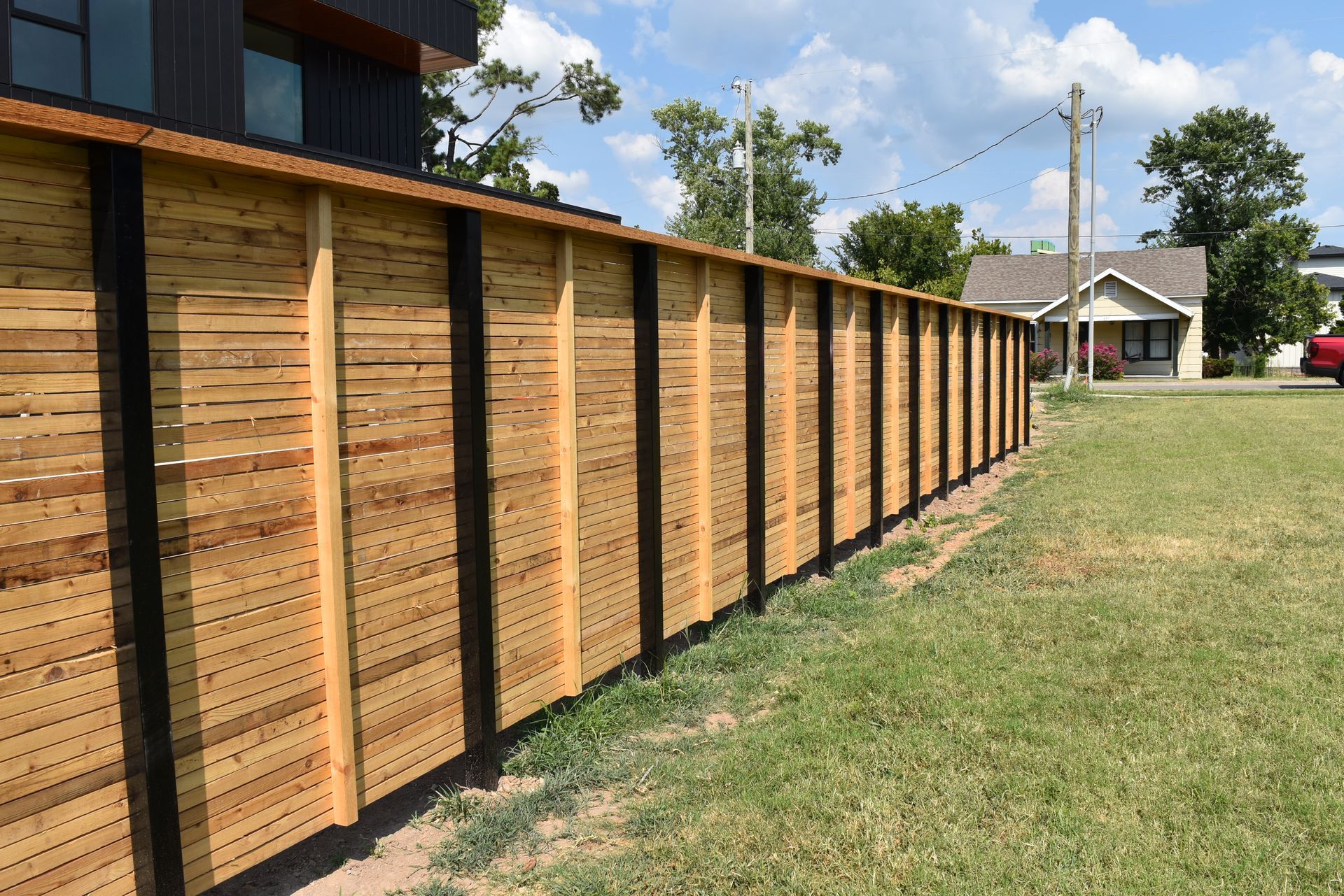 One inch slat fence with steel posts