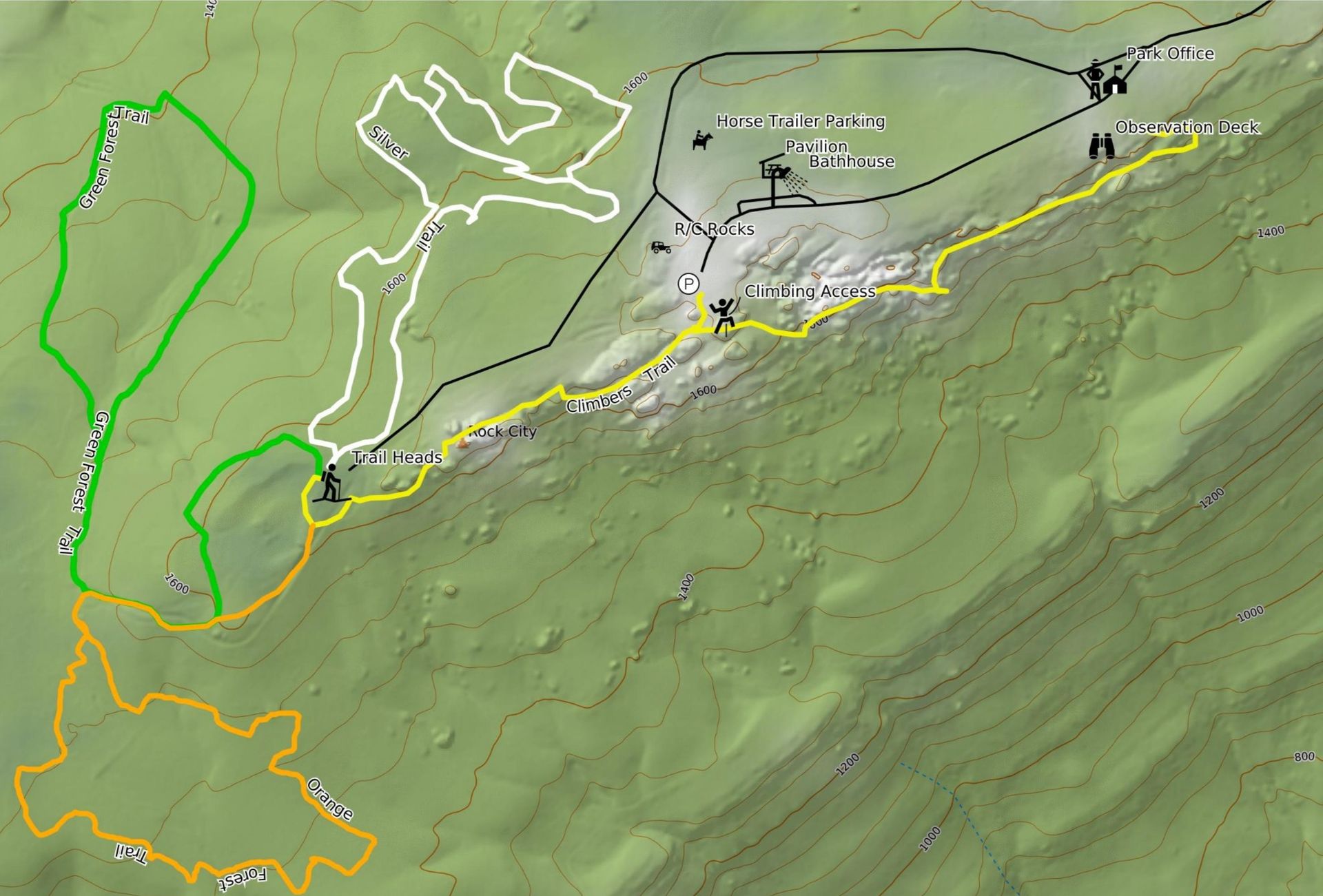 Map showing hiking trails outlined in green, white, yellow, and orange on a hillside, with trail names and markers.