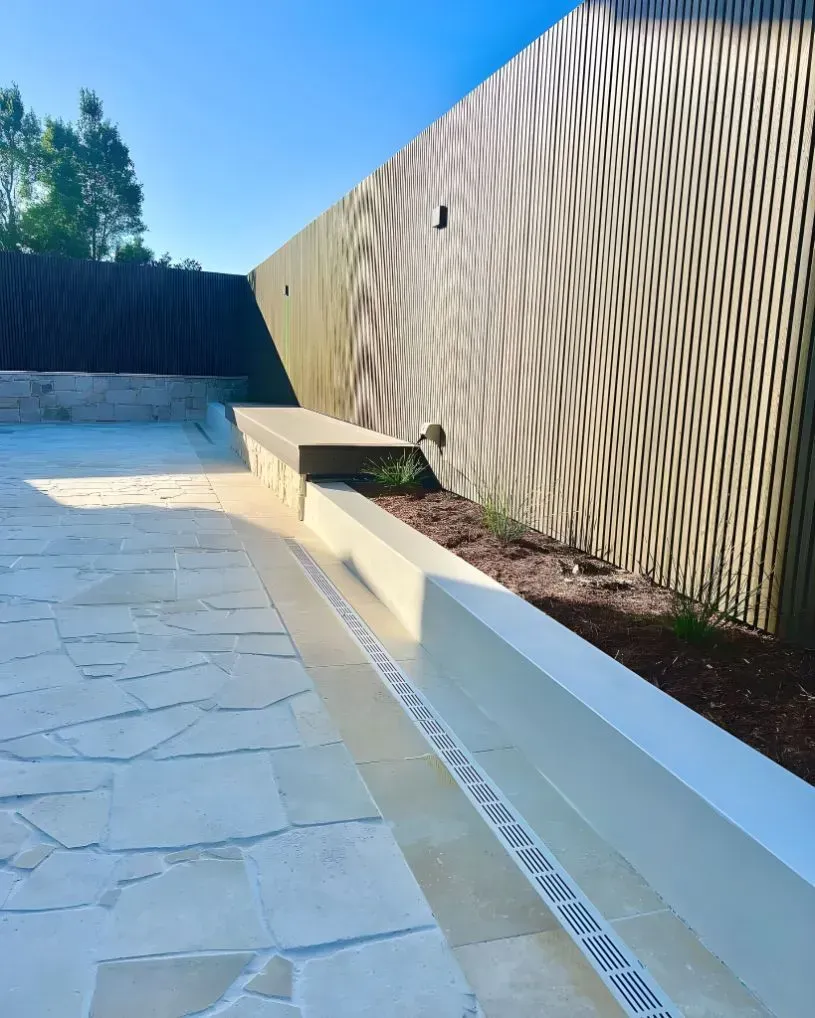 A Modern Outdoor Space Featuring a Paved Stone Patio — Creative Landscapes Coffs Harbour in Korora, NSW