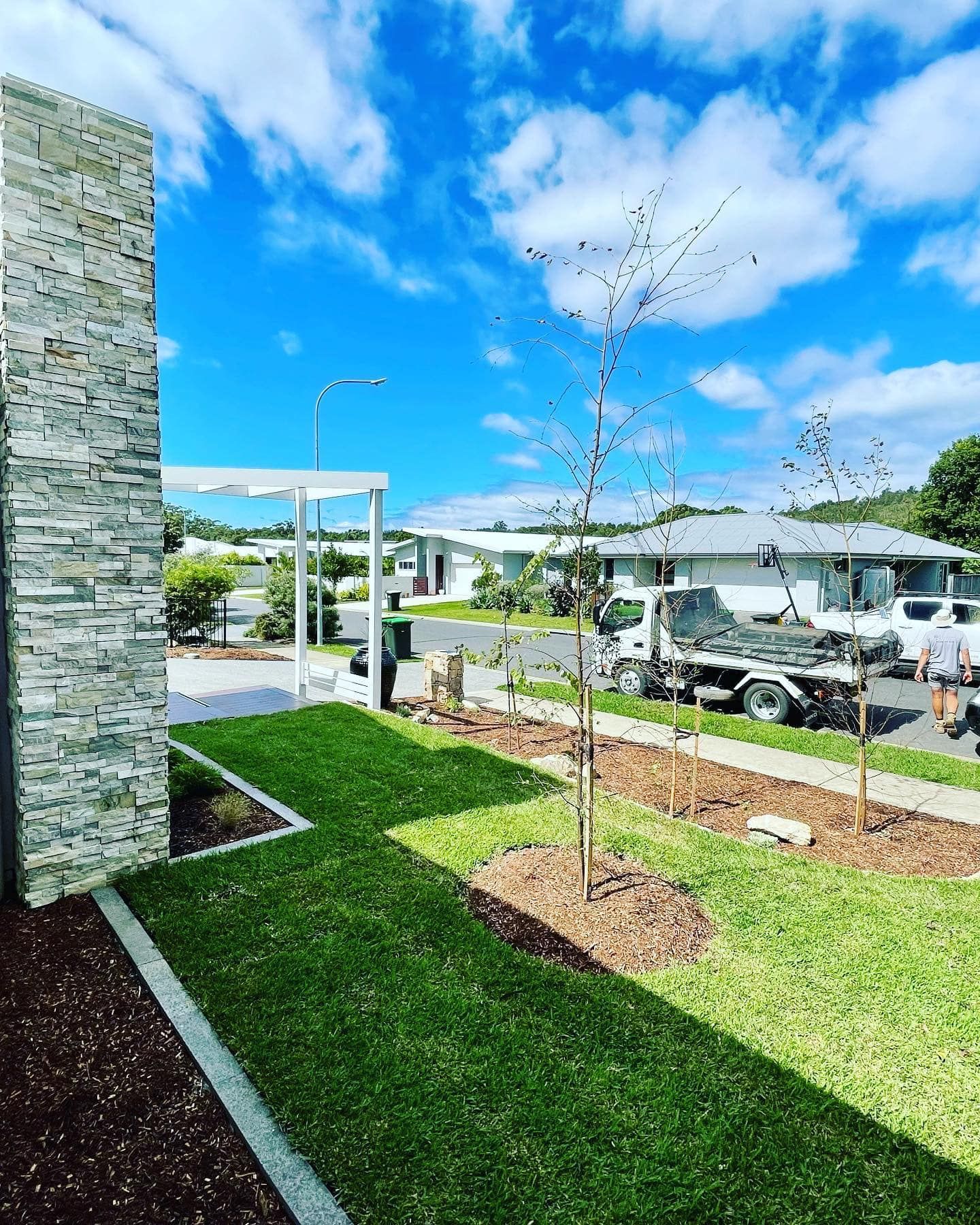 A Suburban Street View Showing a Stone Pillar — Creative Landscapes Coffs Harbour in Moonee Beach, NSW