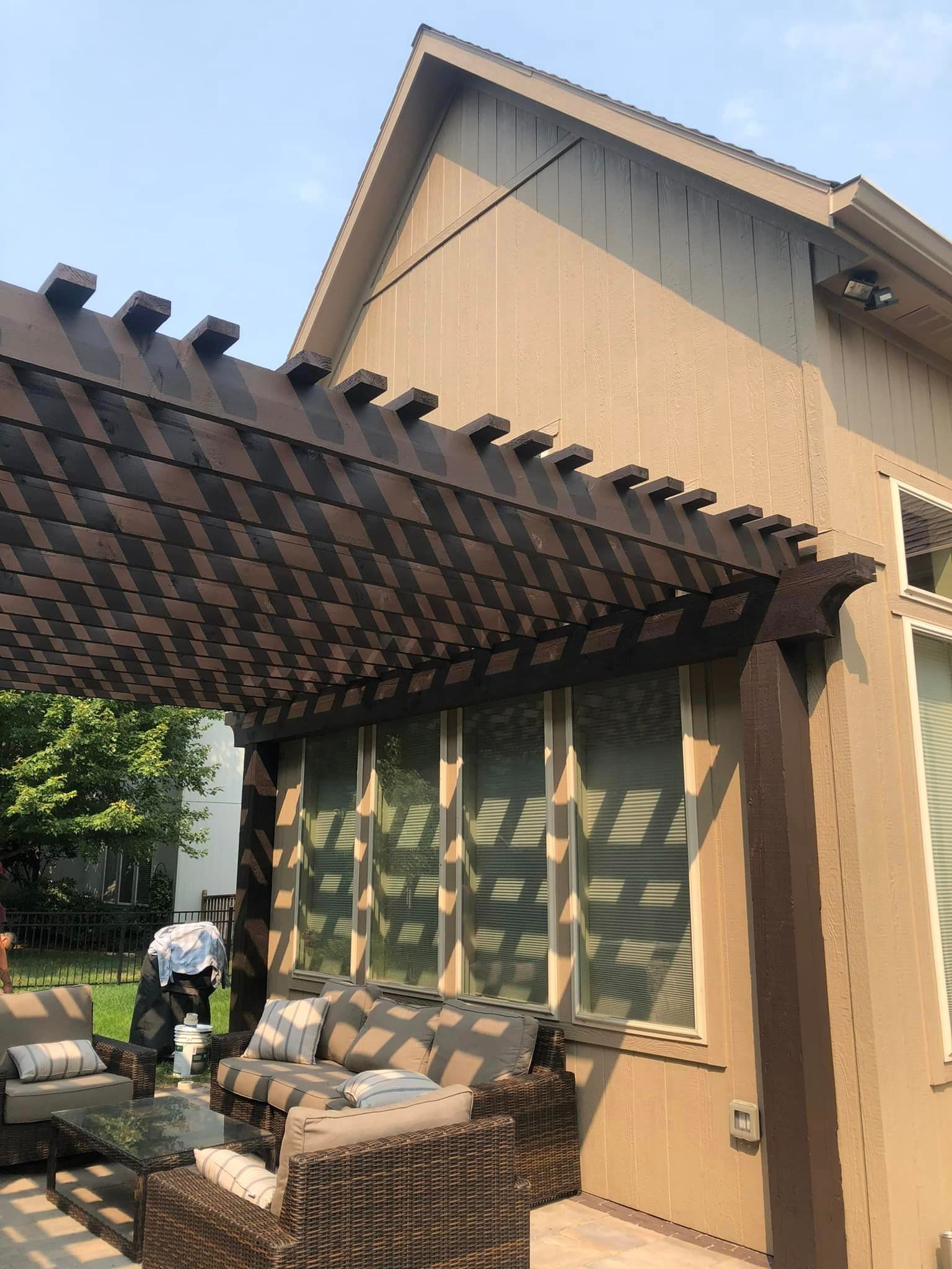 A House With A Pergola And A Couch And Chairs Underneath It – Olathe, KS - JJR Painting