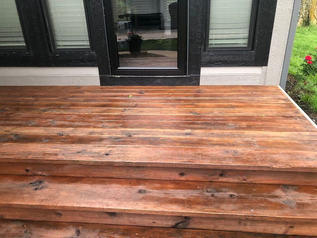 A Wooden Deck With Stairs Leading Up To A House – Olathe, KS - JJR Painting