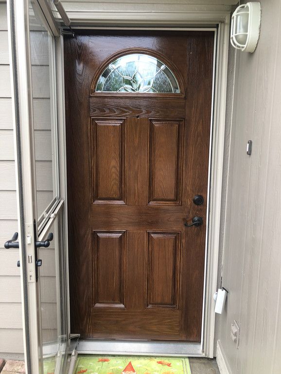 A Wooden Door With A Stained Glass Window Is Open To A Screened In Porch – Olathe, KS - JJR Painting