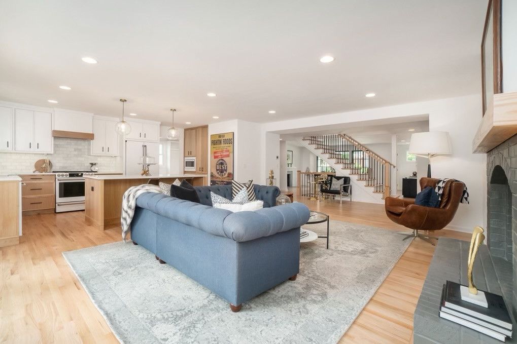 A Living Room With A Blue Couch And A Brown Chair – Olathe, KS - JJR Painting