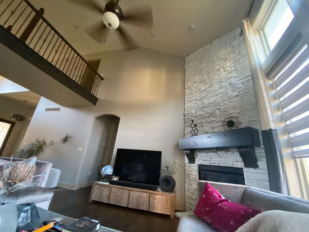 A High Ceiling Living Room With Natural Light – Olathe, KS - JJR Painting