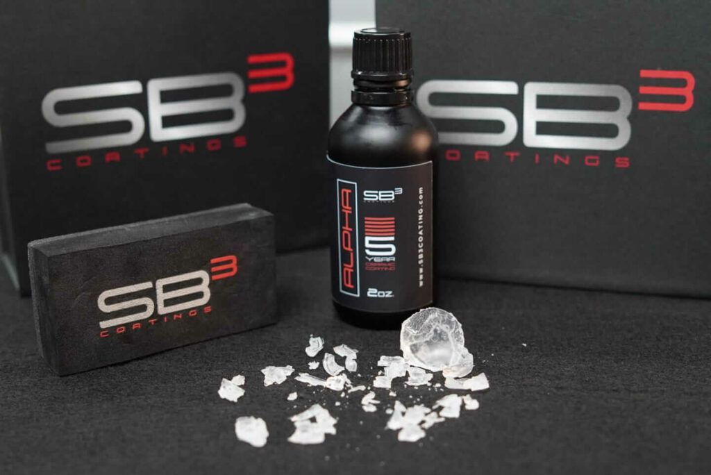 A bottle of sb3 coatings sits on a table