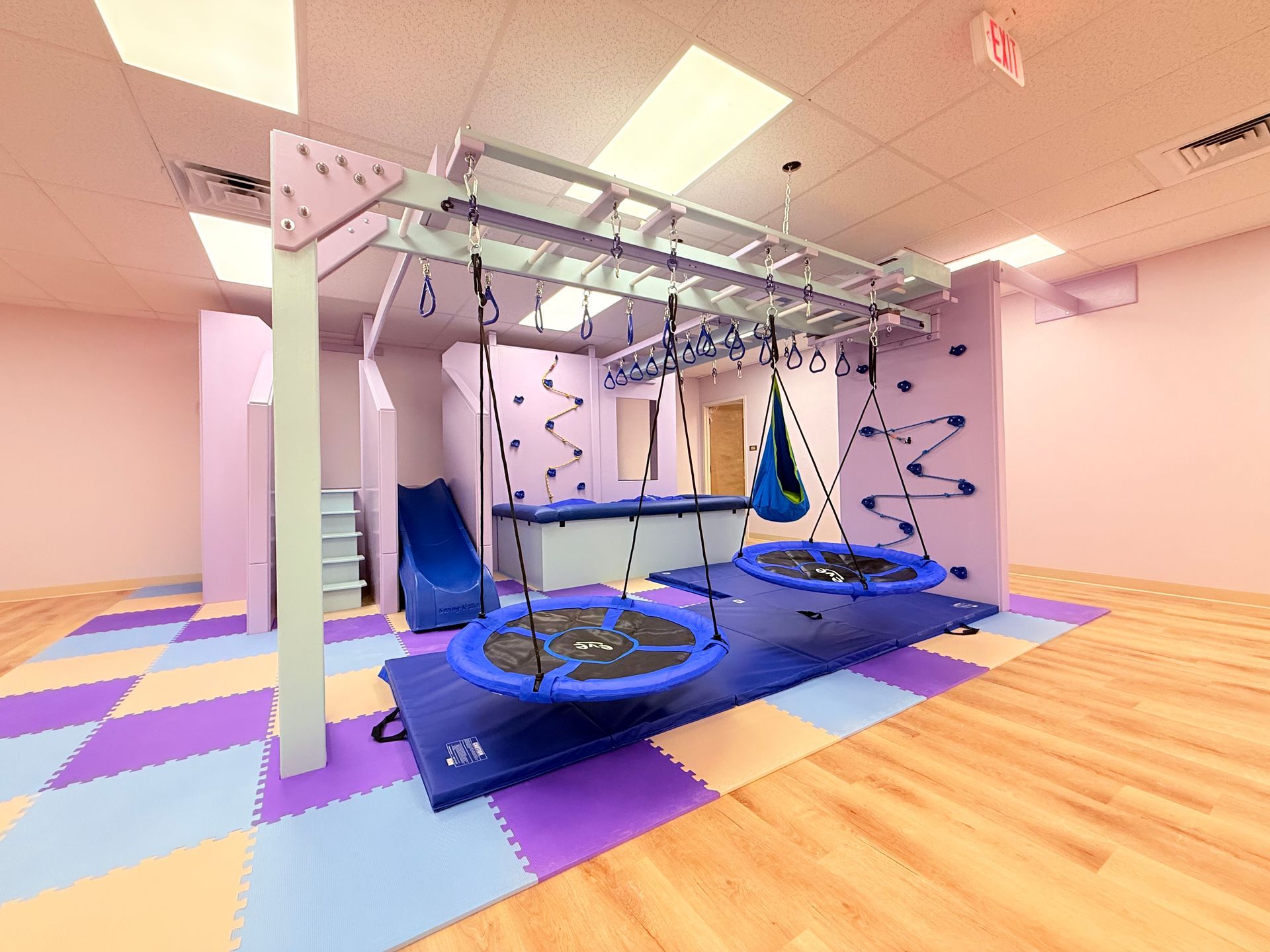 Multi-purpose swing connection positions on a sensory gym system