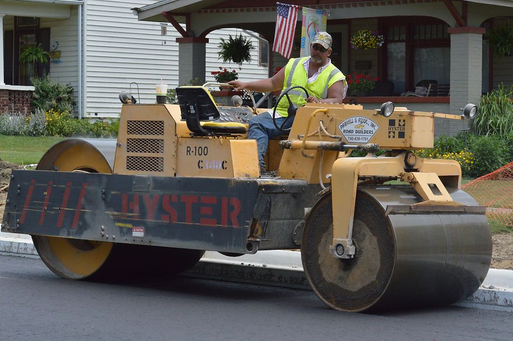 Worker Riding the Road Roller Machine — Cambridge, OH — Parnell & Associates