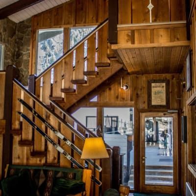 A wooden staircase leading up to the second floor of a house