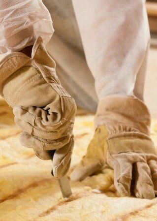 Cutting the Material — Insulation Repair in Northbrook, IL