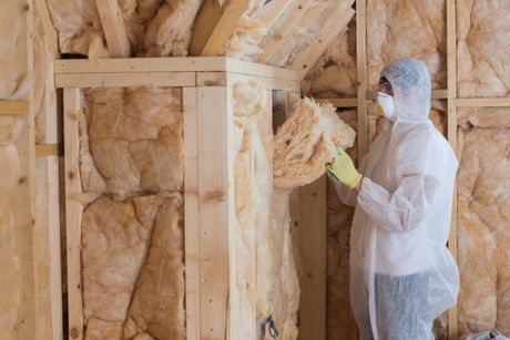 Man put Fiber on Walls — Insulation Services in Northbrook, IL