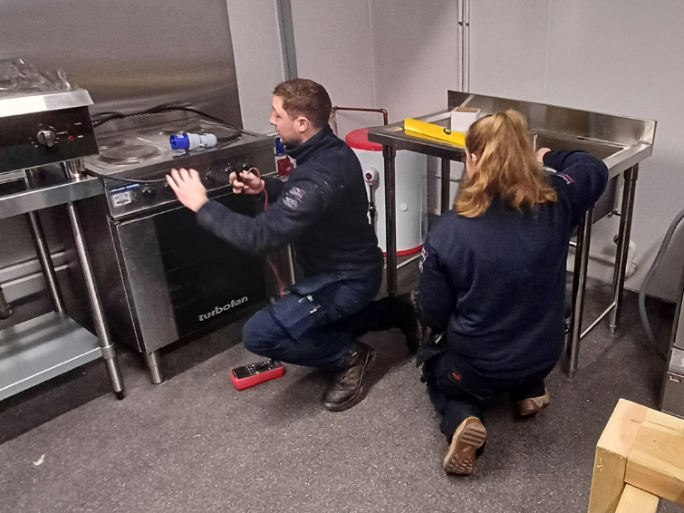 MCFT Trainee Technicians installing commercial kitchen equipment