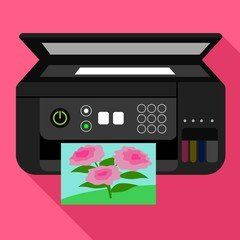 Uma impressora está imprimindo uma imagem de flores em um fundo rosa.
