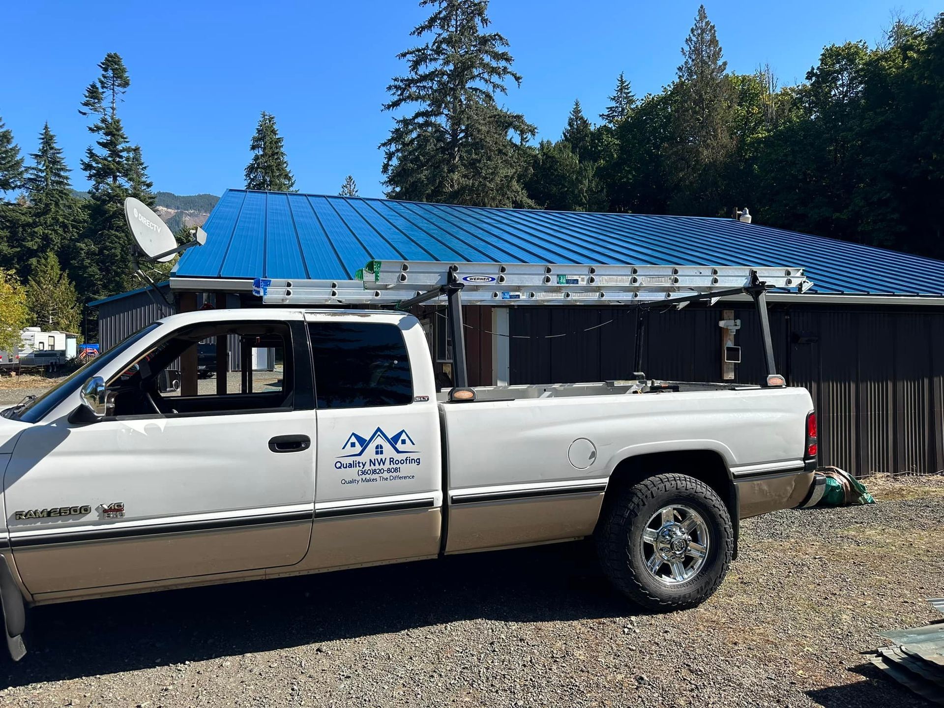 New metal roof and Quality NW Roofing's truck