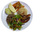Plate of food: rice, beans, salad, plantains, vegetables, and boiled breadfruit.