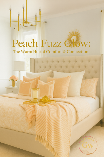 A peach-colored bedroom with a tufted bed, pillows, blanket, and a decorative tray, bathed in soft light.