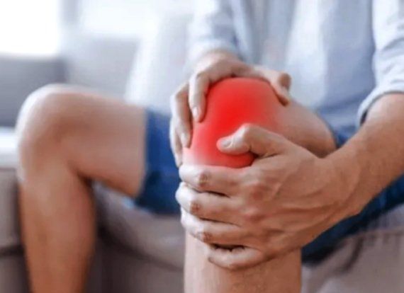 A person clutching his knee due to pain | regenerative center | Amarillo Regenerative Medicine Center