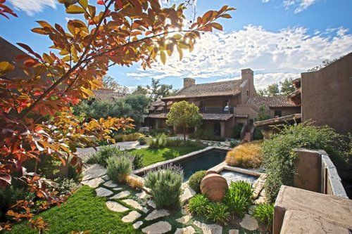 A large house with a swimming pool in the backyard
