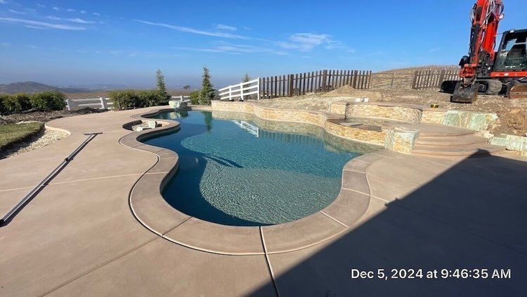 A fountain with a statue of a woman standing in the middle of it.