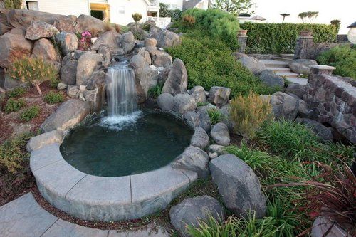 There is a small waterfall in the middle of the garden.