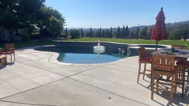 A fountain with a statue of a woman standing in the middle of it.