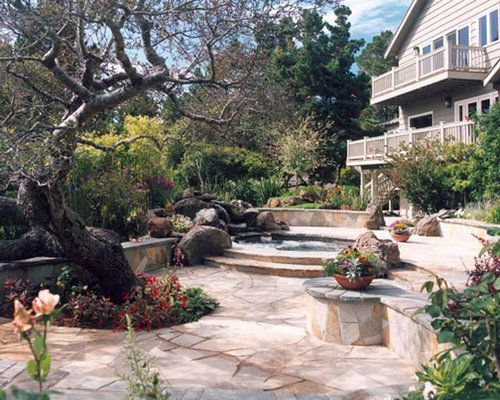 A large house with a patio in front of it