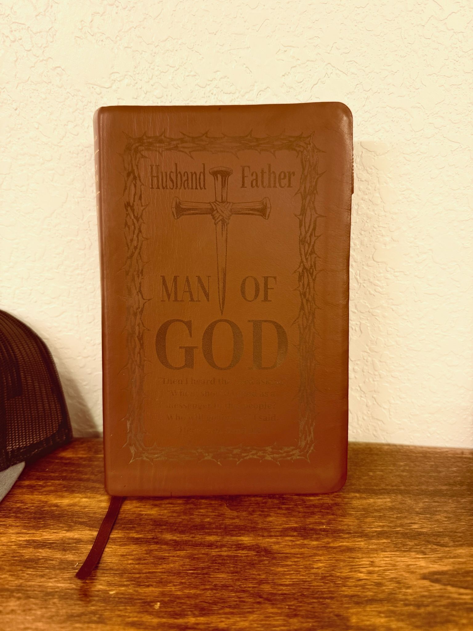 A brown leather-bound bible with custom engraving 