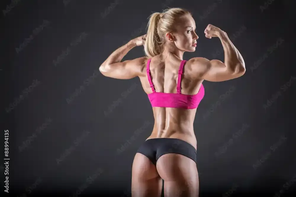A female bodybuilder is showing off her spray tan near Austin, Texas