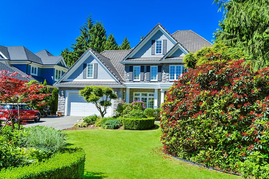 Maple Ridge Tree Service Maple Ridge - House with manicured landscaping and shrubs