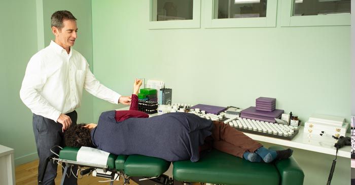 woman being treated by Applied Kinesiology Practitioner Dr. Louis Granirer