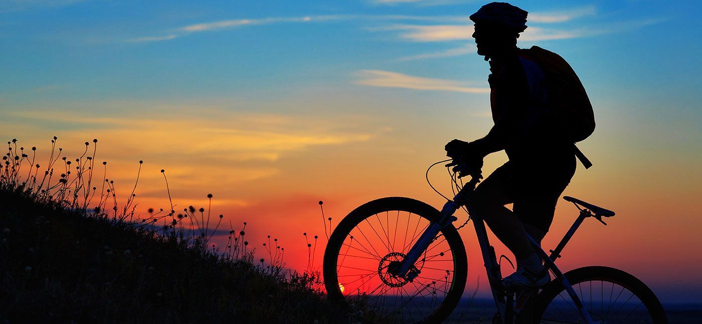 Bicyclist with sunset in the background