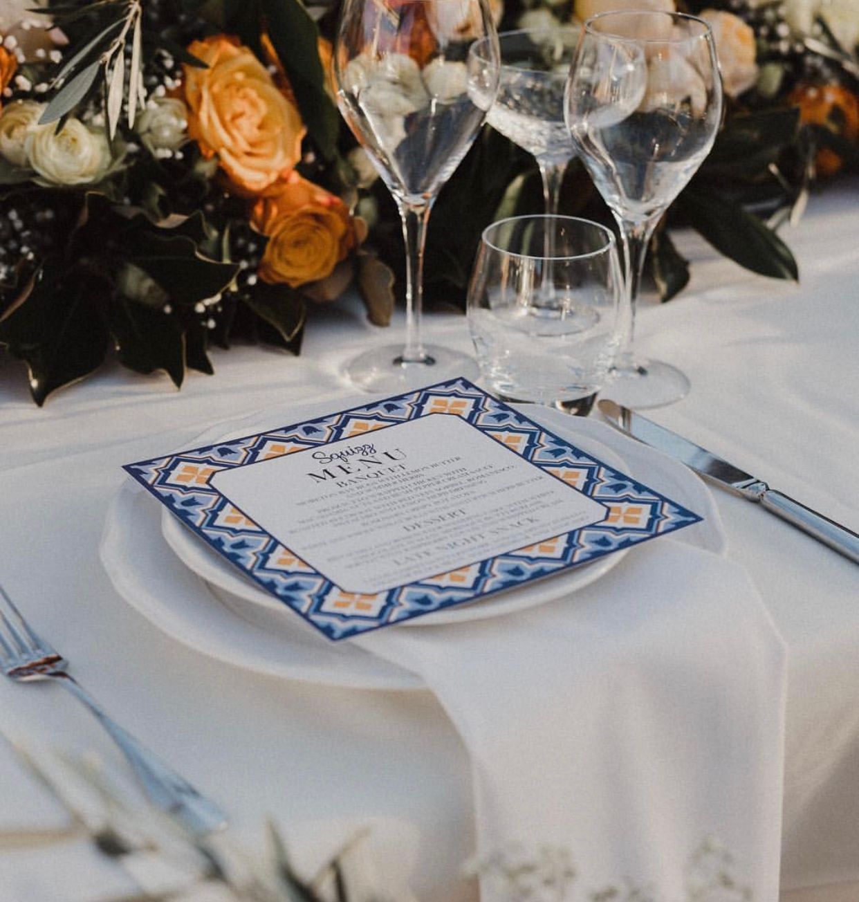 A plate with a menu on it sits on a table