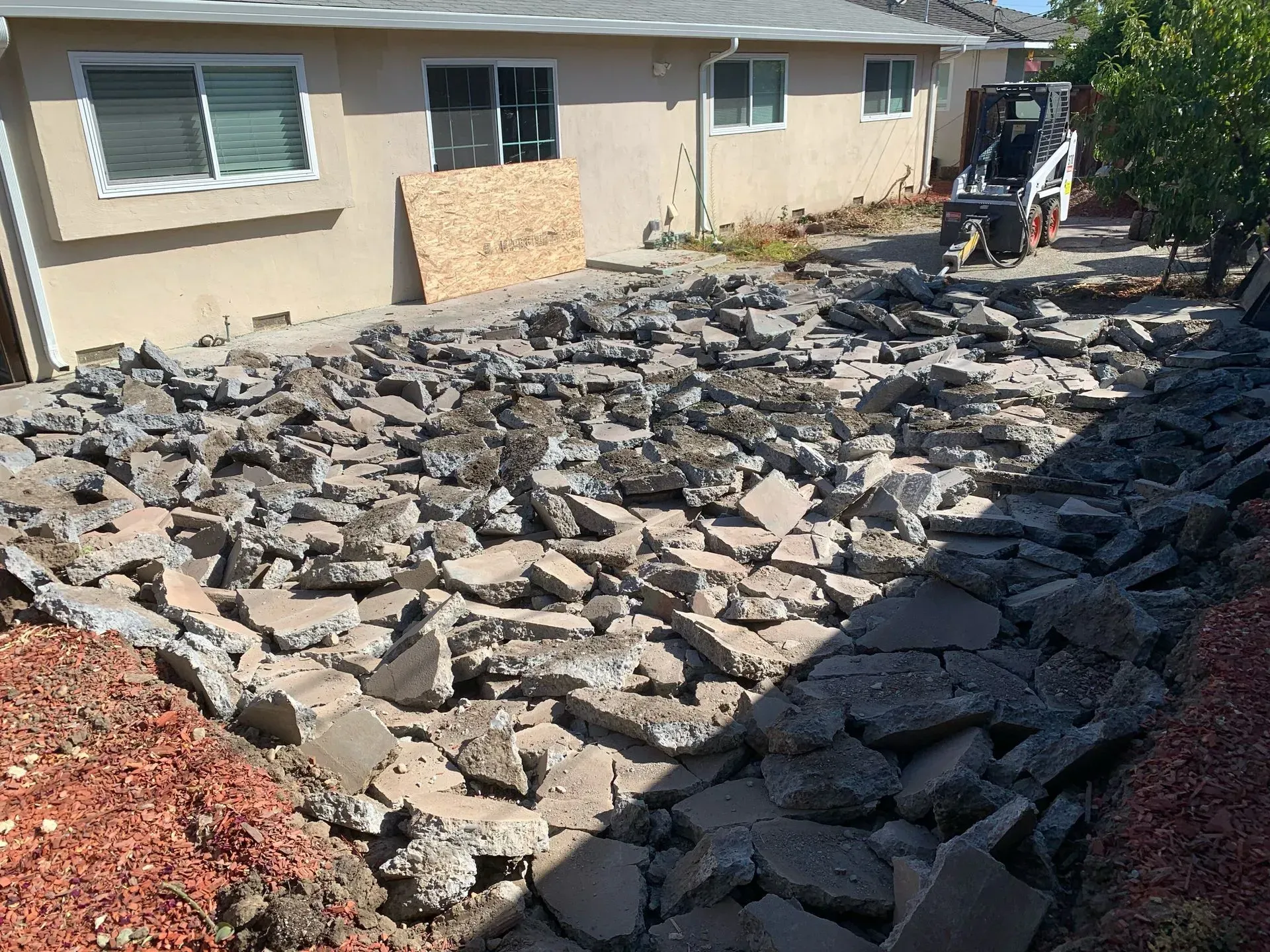 A house with a lot of rocks in front of it