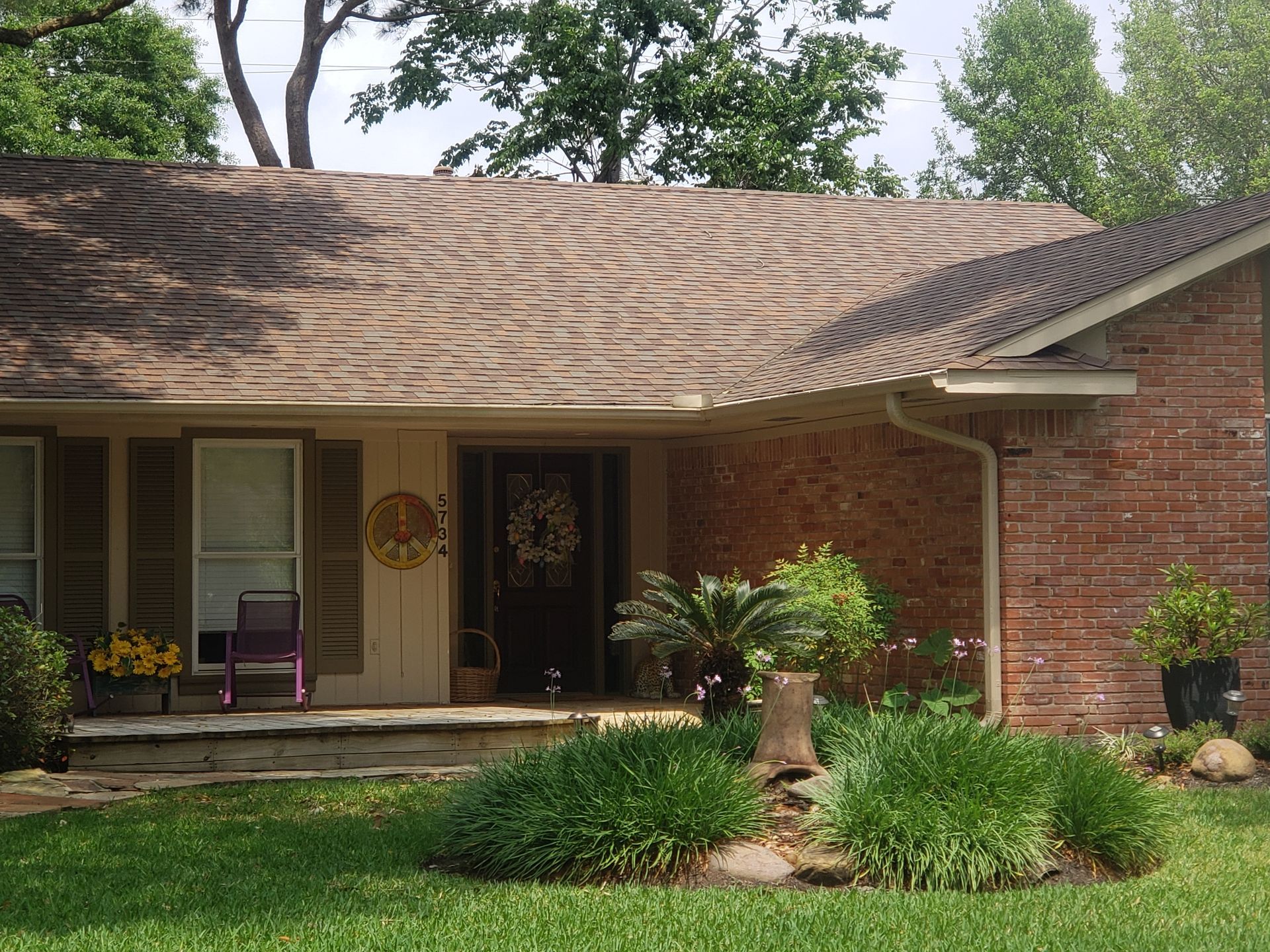 A brick house with a wreath on the front door