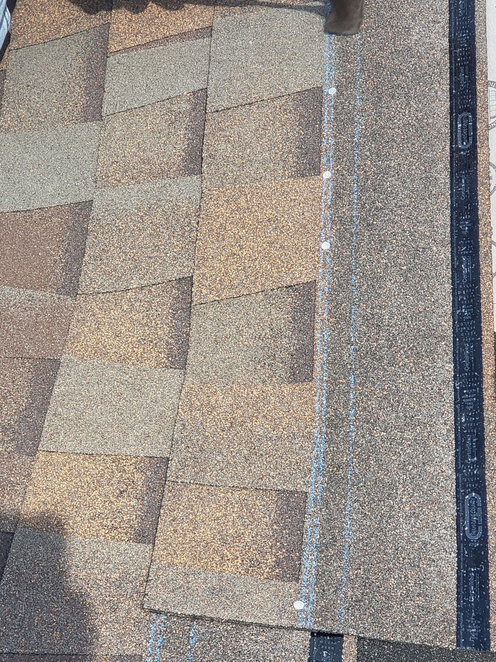 A close up of a roof with shingles on it.