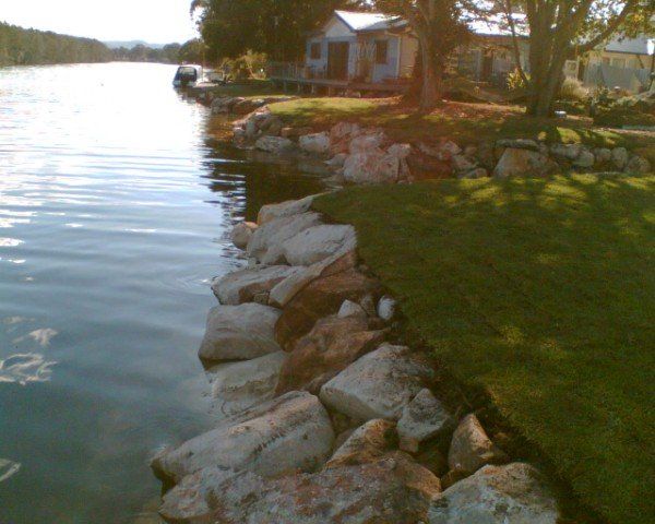 large rocks next to body of water