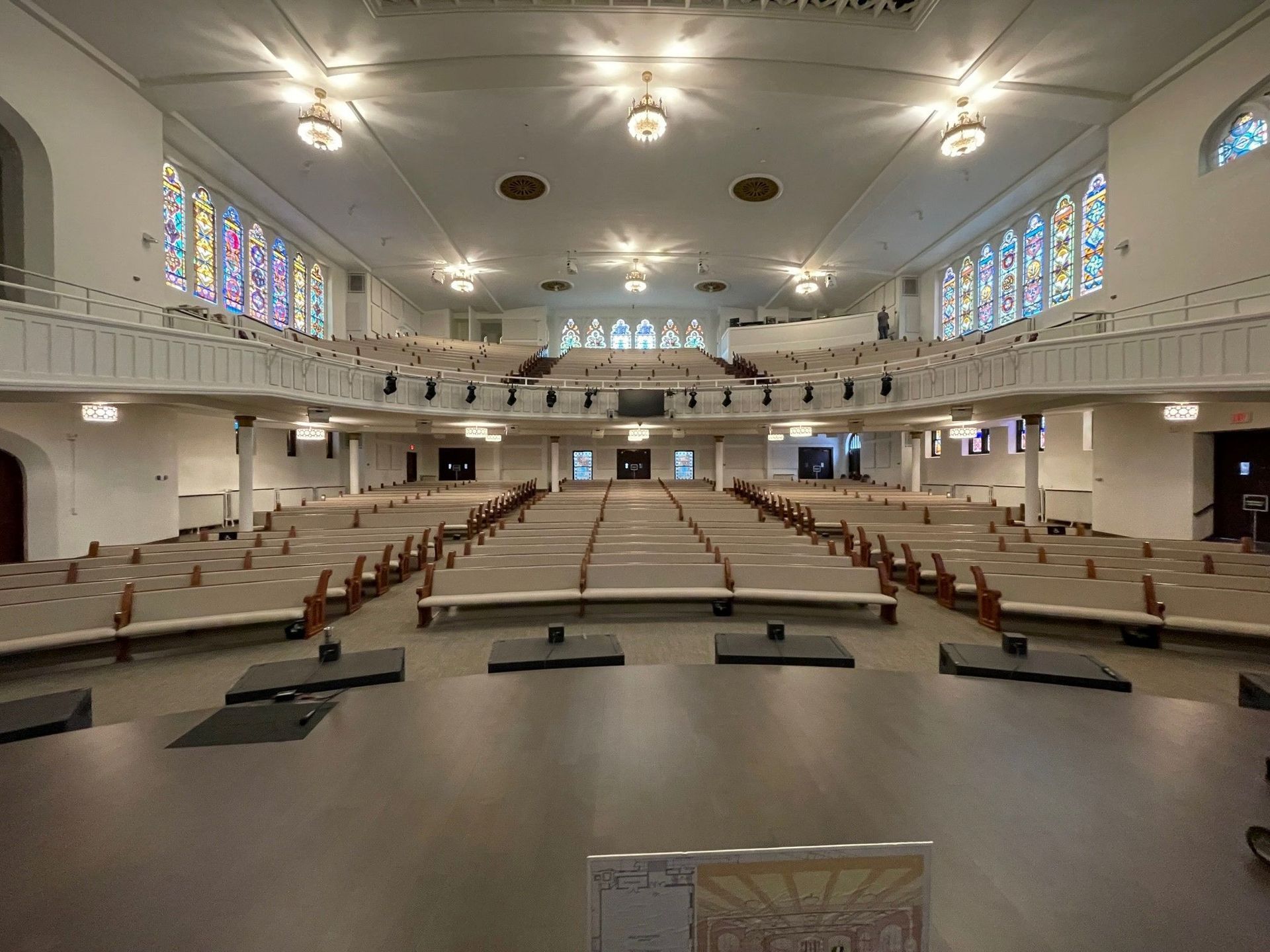 A Large Empty Church With Stained Glass Windows
