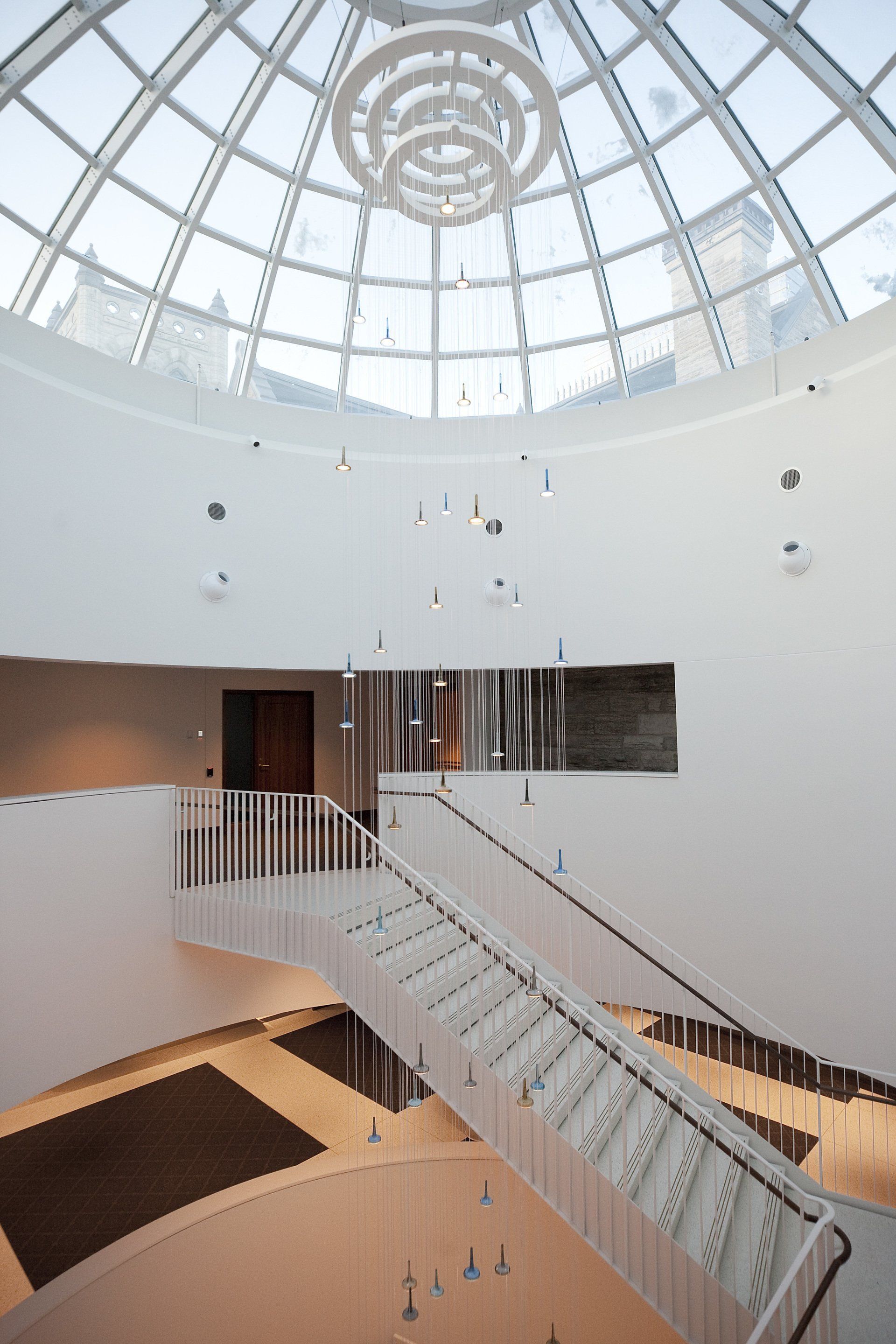 A staircase in a building with a dome ceiling