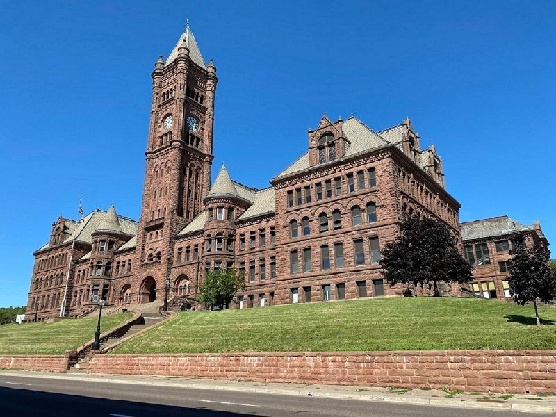 A large brick building with a clock tower on top of it.