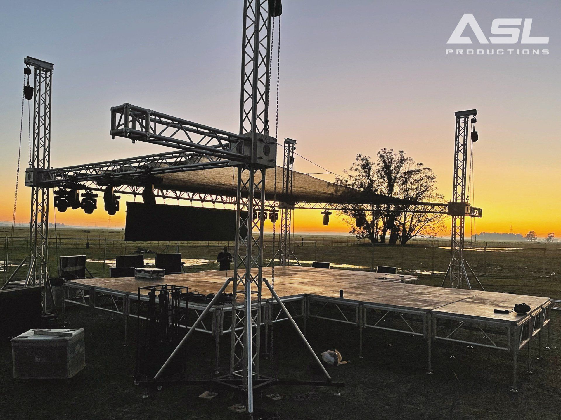 a stage set up by asl productions at sunset