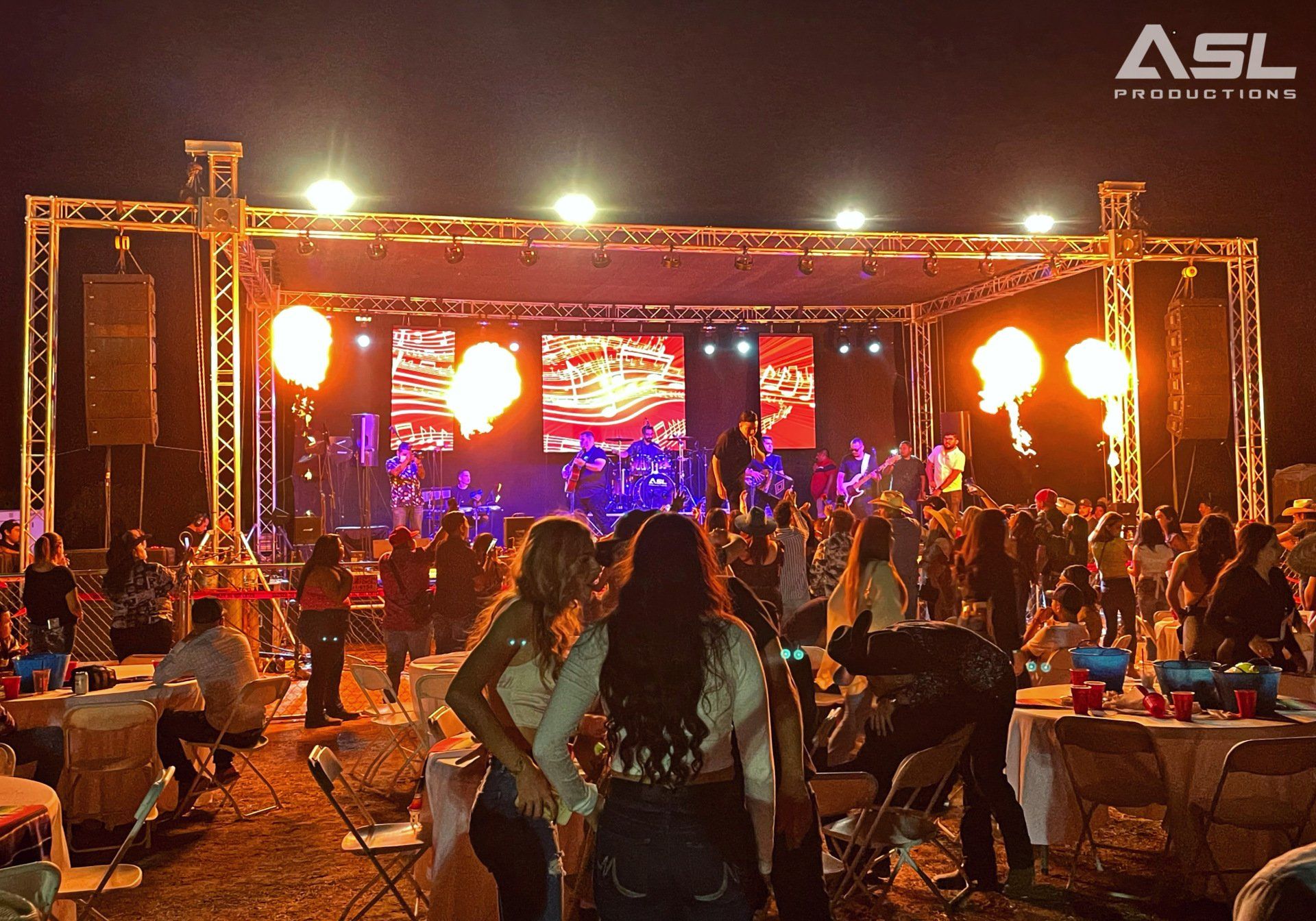a large group of people are gathered in front of a stage that says asl on it