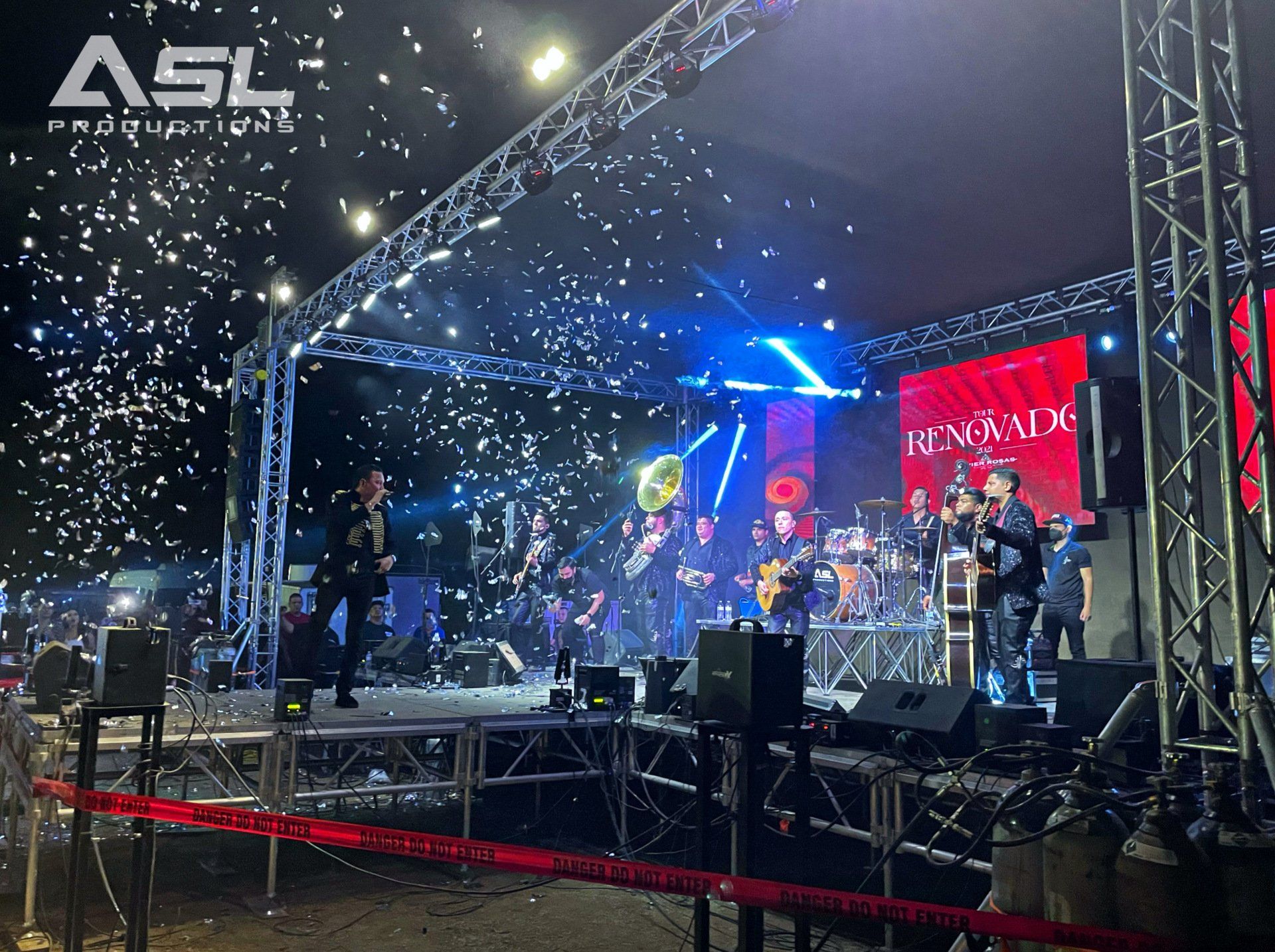 a group of people are standing on a stage in front of a sign that says asl