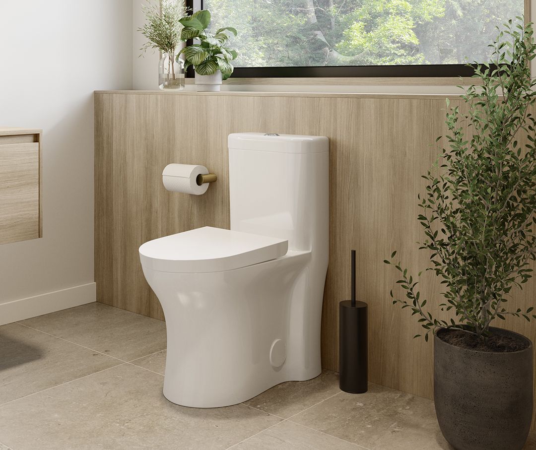 A white toilet is sitting in a bathroom next to a window.