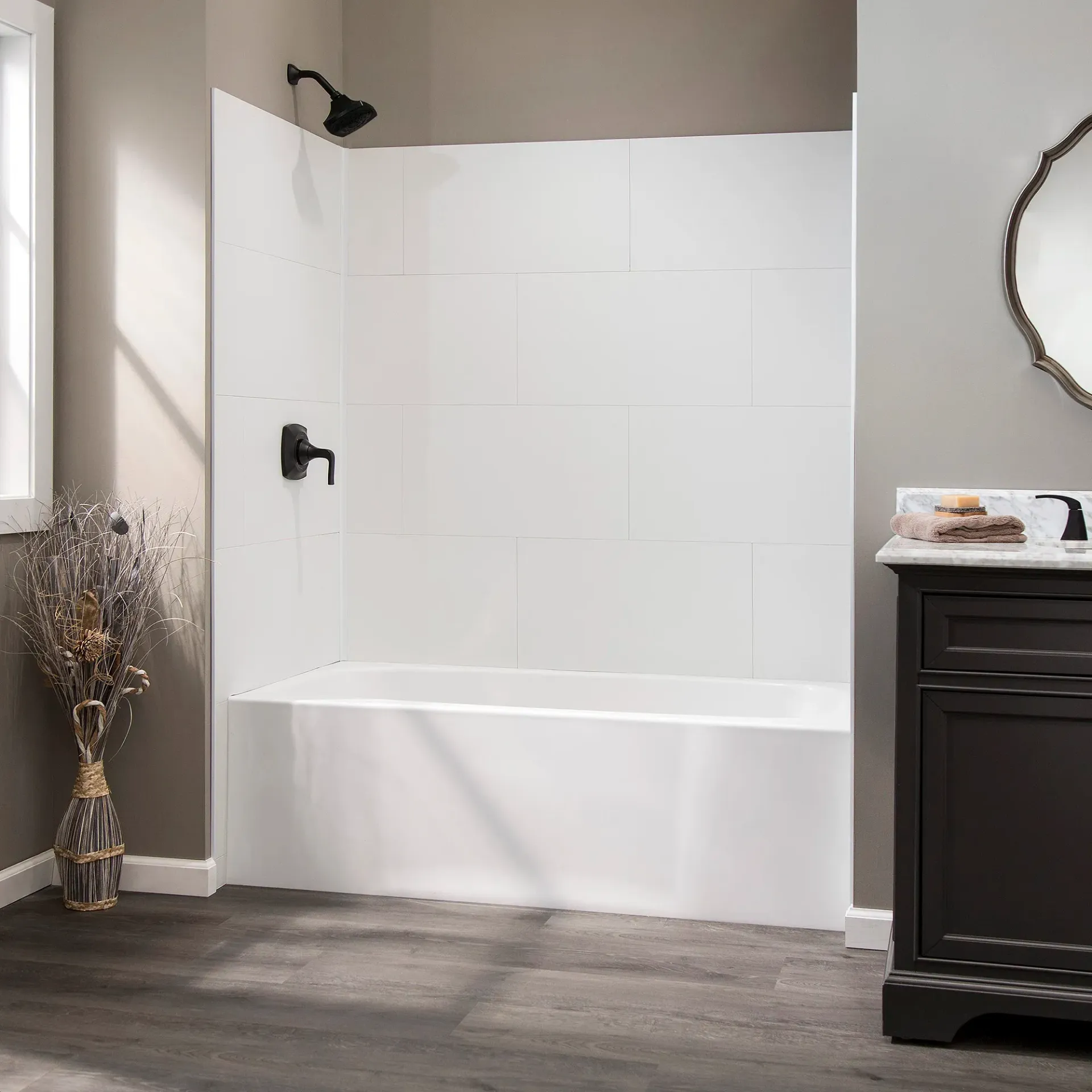 A bathroom with a bathtub and a mirror