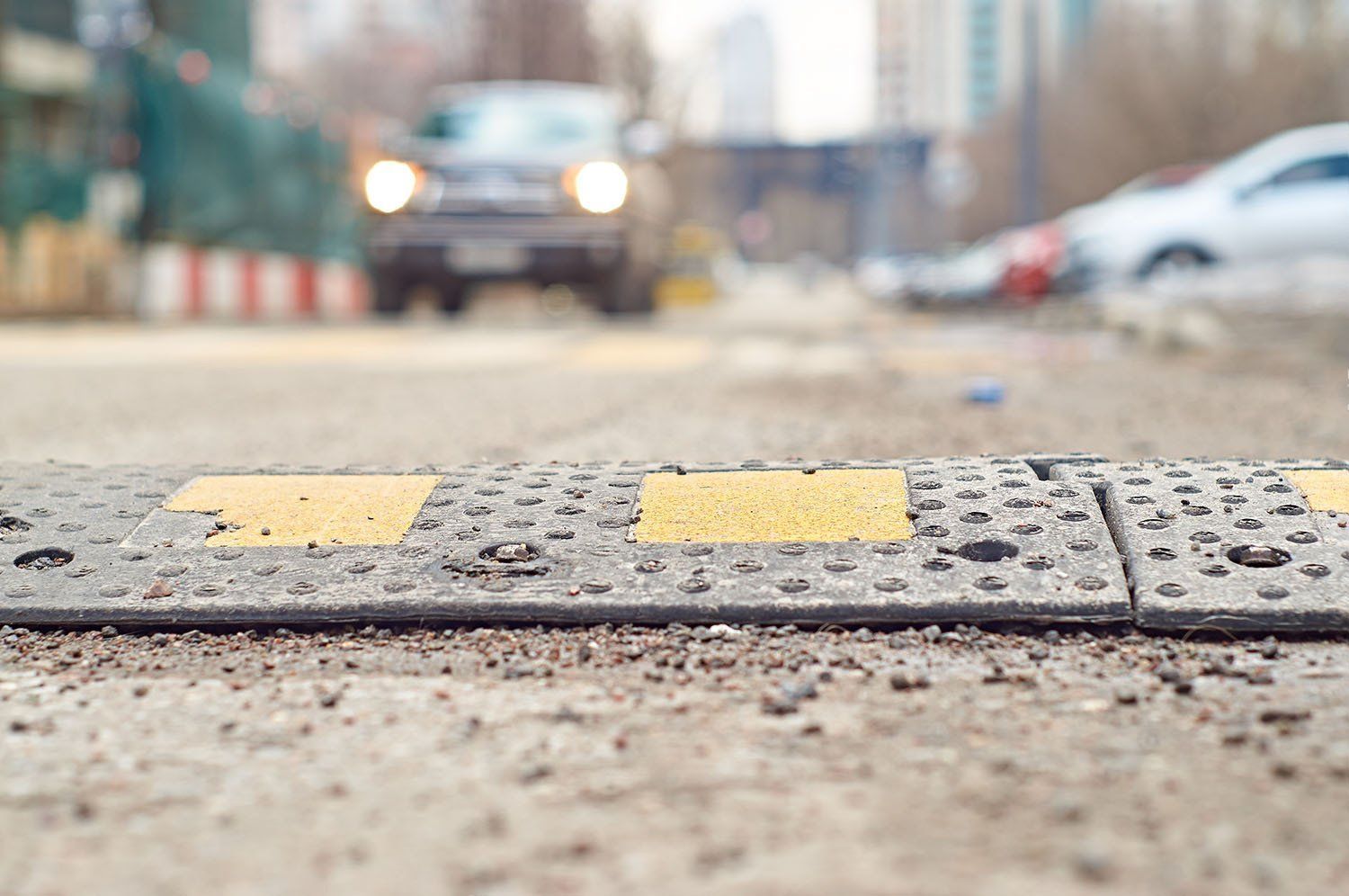 A close up of a speed bump on the side of a road.
